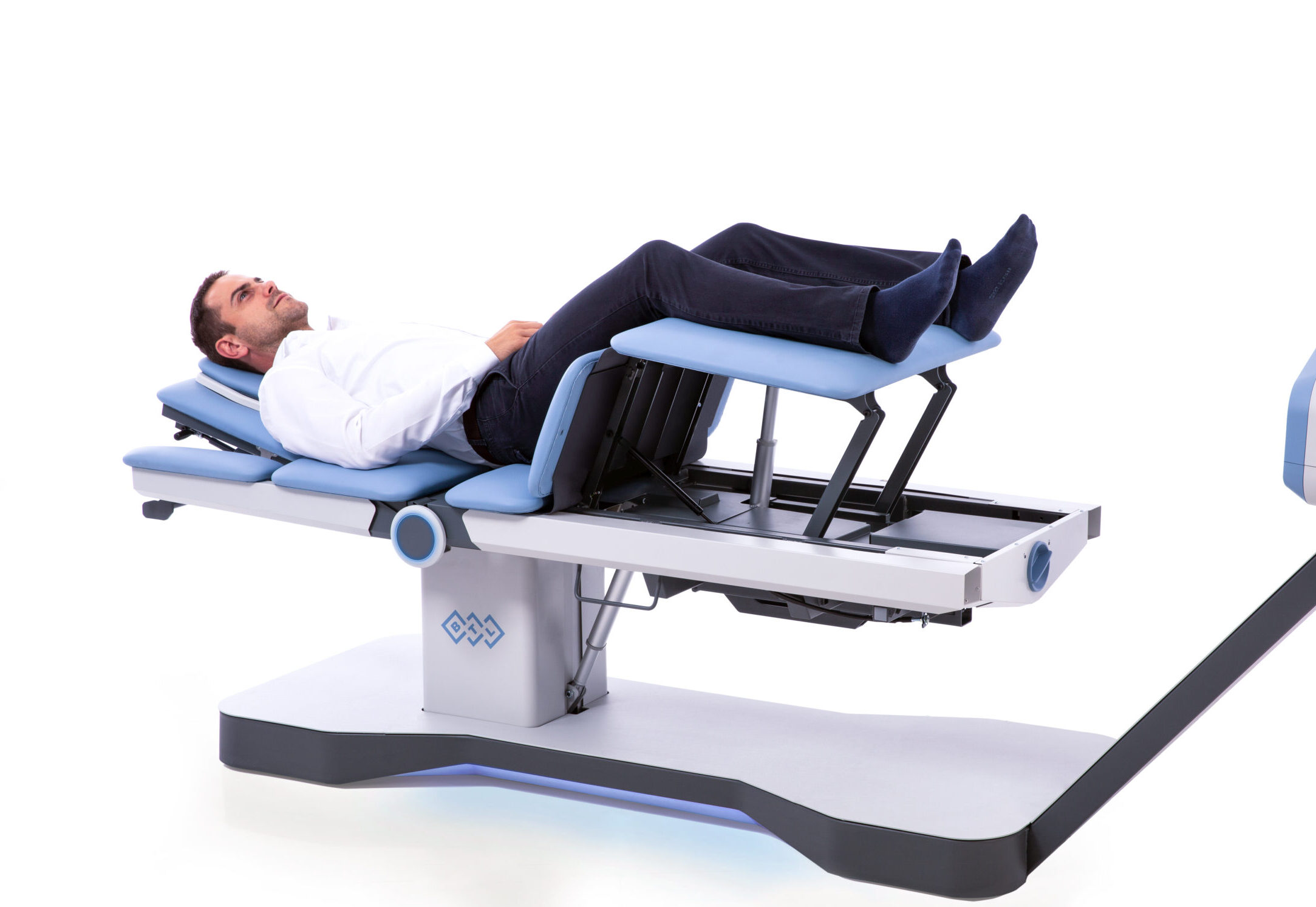 Patient lying on a spinal decompression table at Cornerstone Medical Group